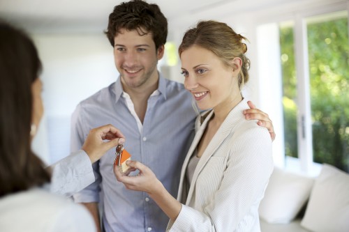 Young couple being house owners